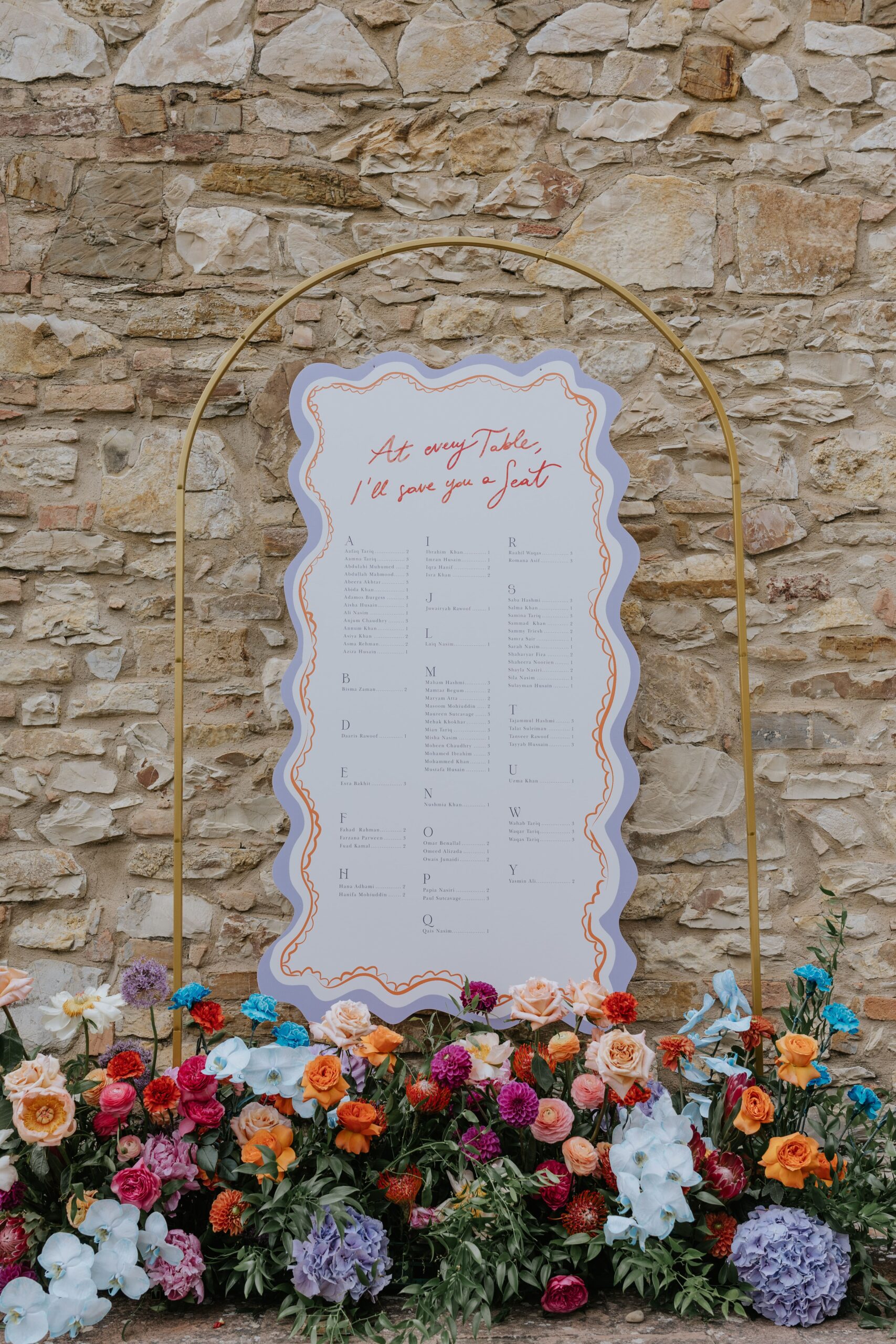 A colorful and lush wedding table seat