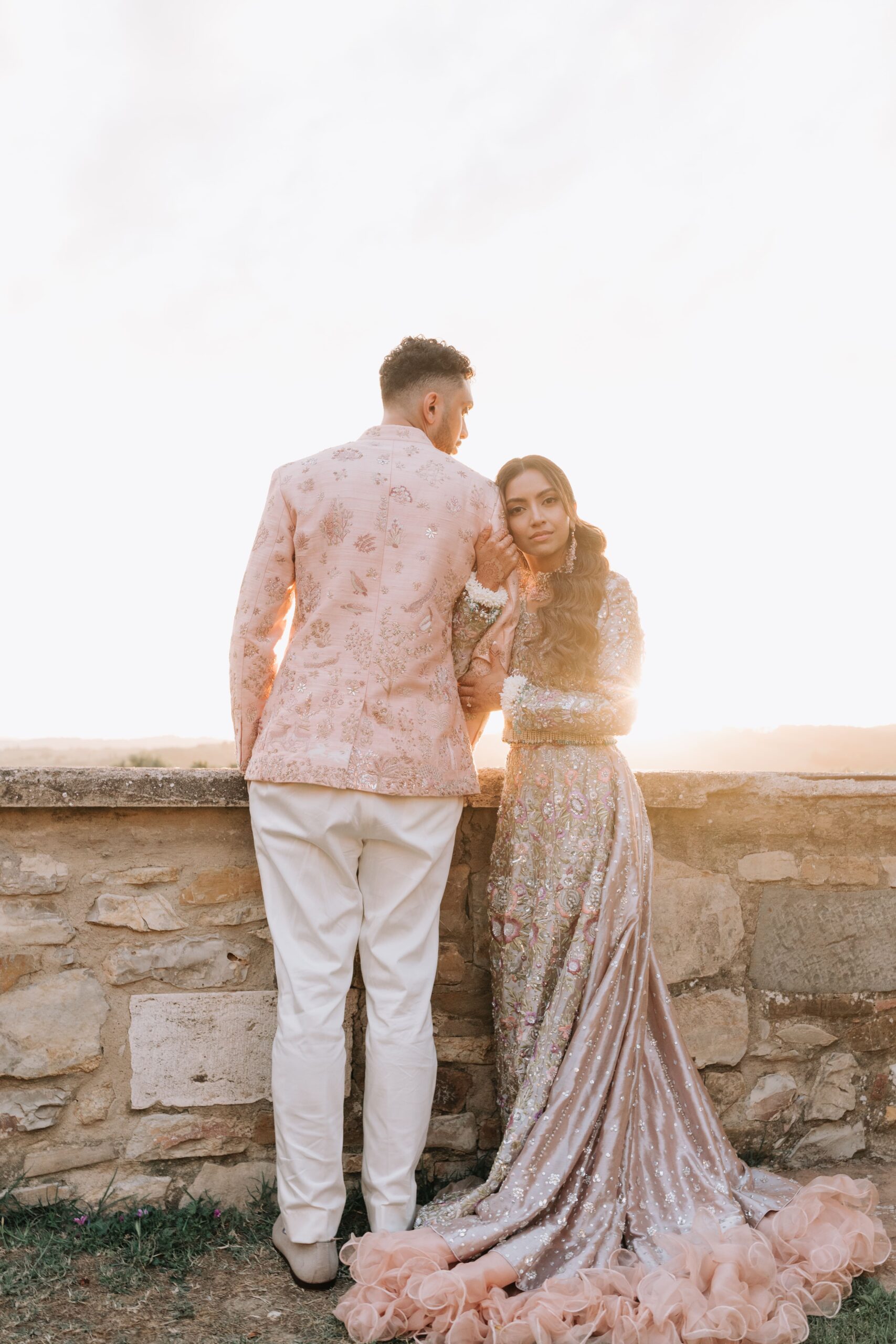 The bride and the groom at the sunset