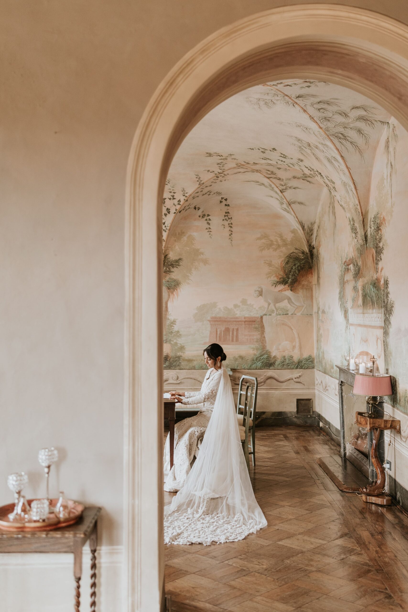 The bride in pose inside her wedding venue