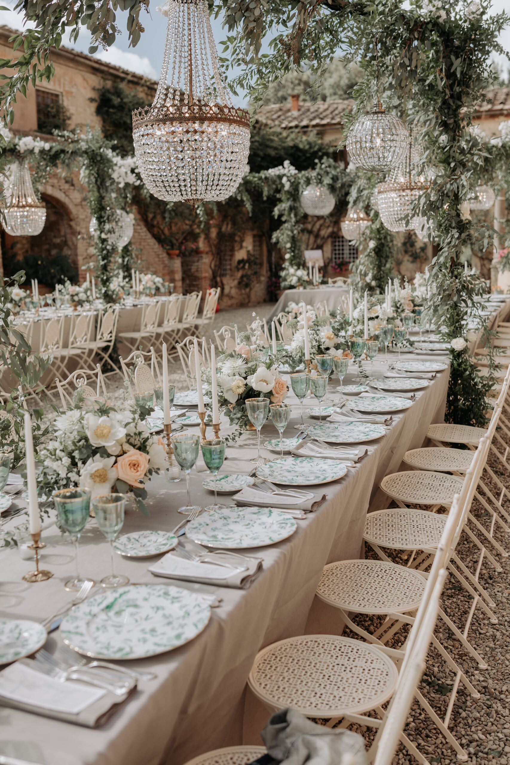 Imperial tables with candles and crystal chandeliers