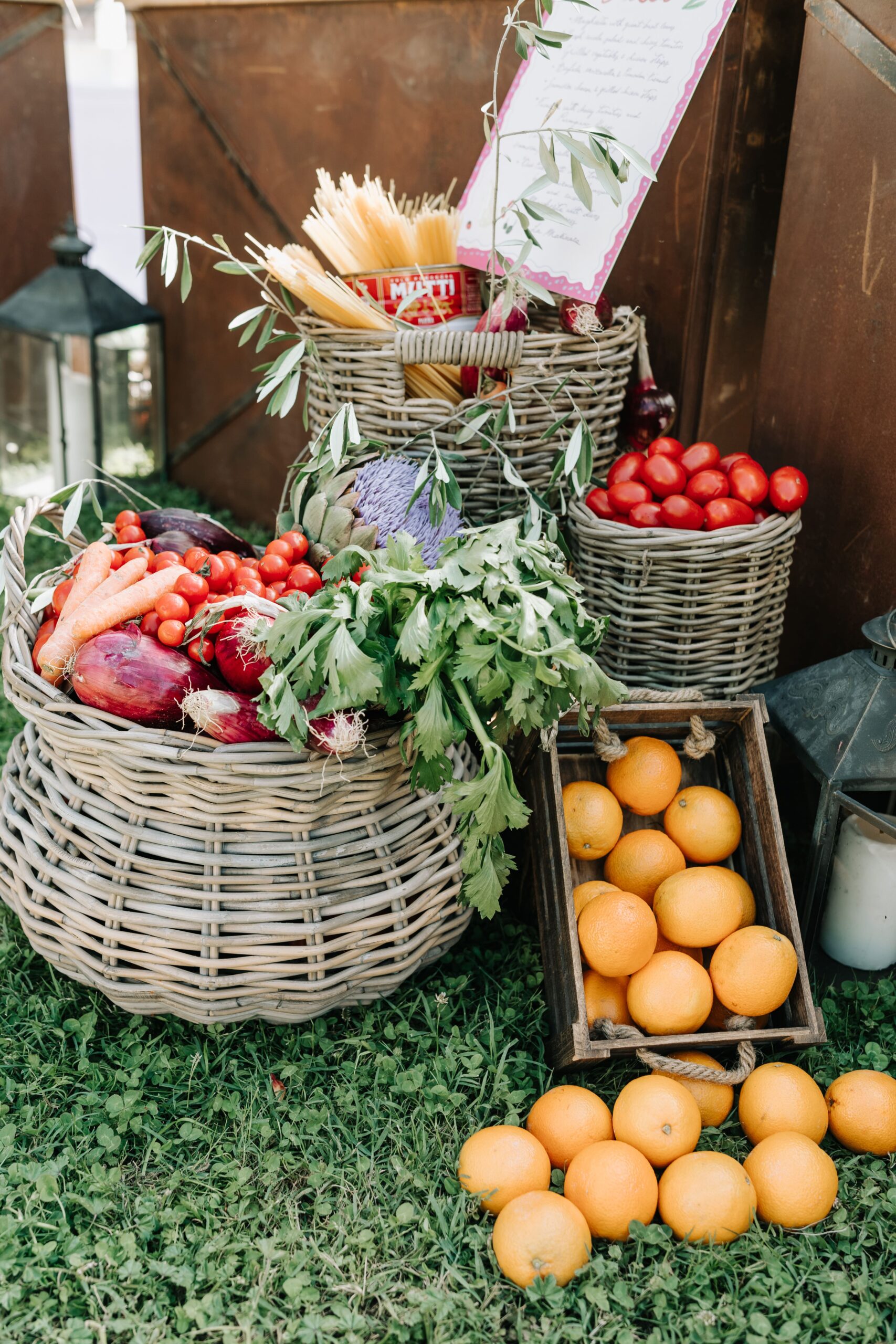 A Tuscan and rustic wedding setup with carrots, tomatoes and oranges